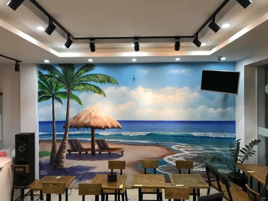 vẽ tranh tường cảnh biển tại quán ăn